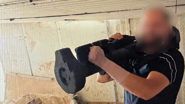 One of the defendants is seen holding the missile