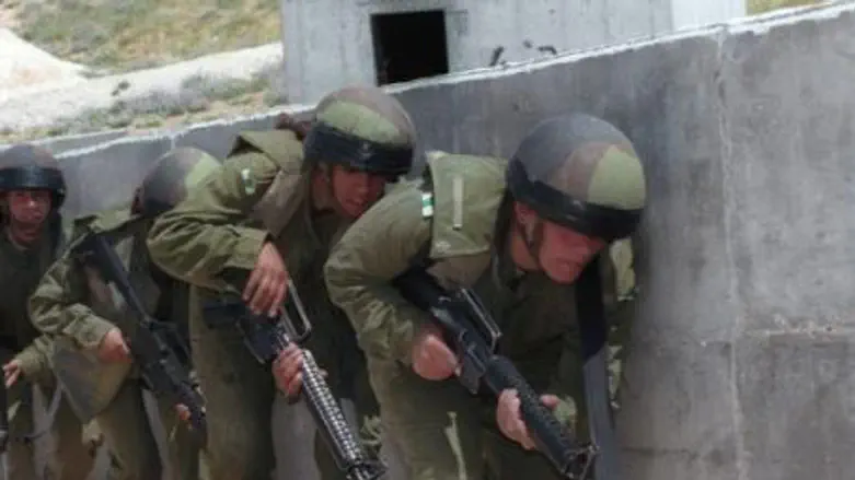 Police crouch behind a wall