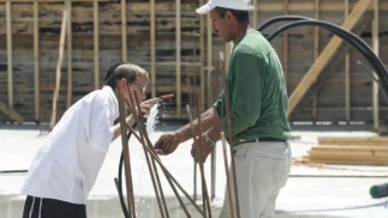 Sharing a drink at construction site.