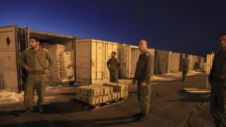 Soldiers guard weapons (illustrative)