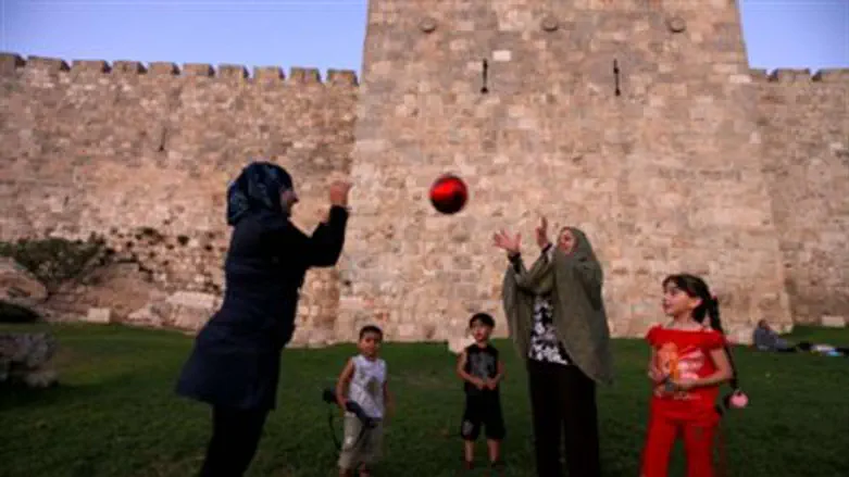 Muslims near Old City wall (file).
