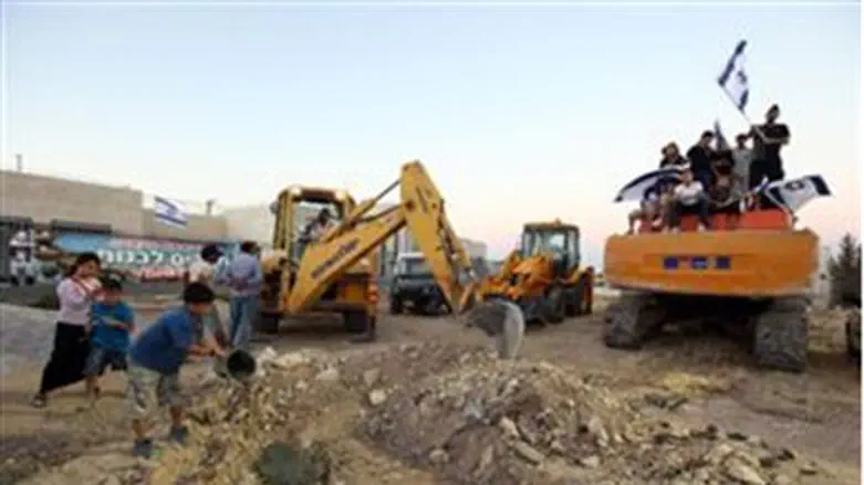 Building resumes in the town of Adam