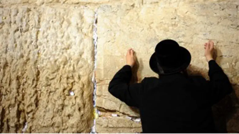 A Jew prays at the Western Wall