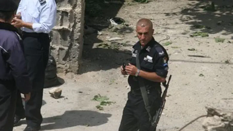 Armed Arab policeman - seen from Hadassah Hou
