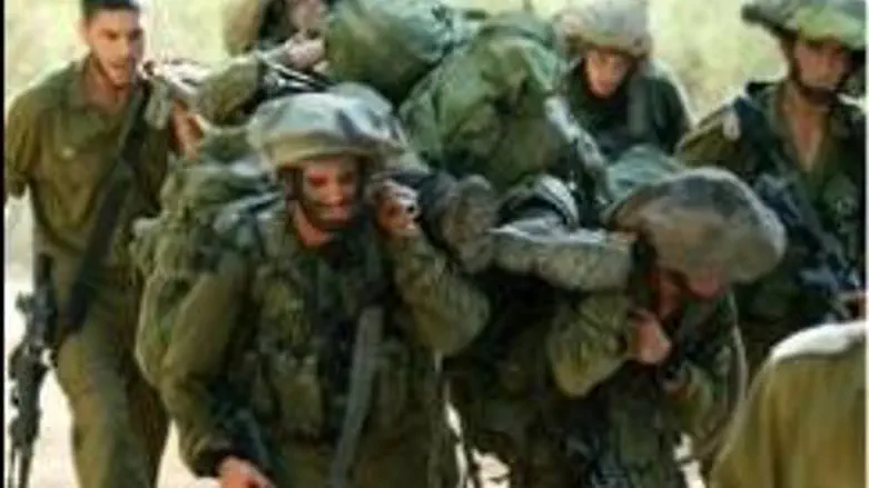 Soldiers carrying wounded comrade