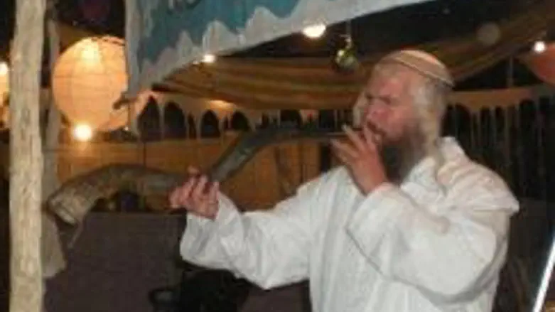 blowing shofar at "Kfar Tefillah" tent