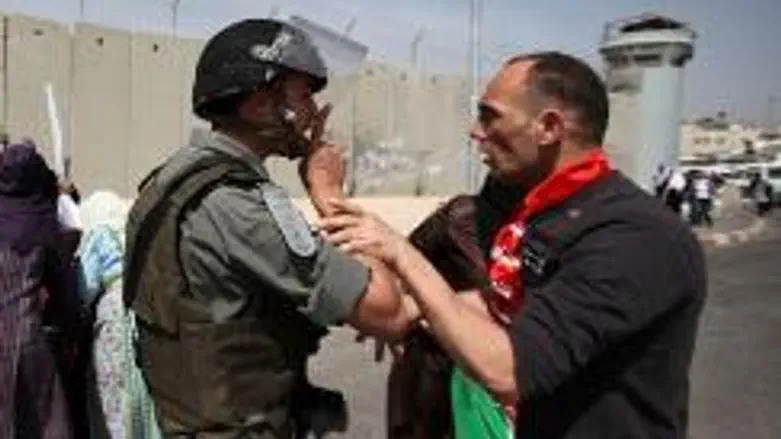 Arab and Israeli policeman at checkpoint