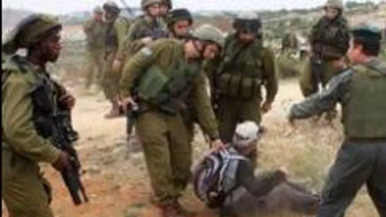 Soldiers arresting pro-Arab activist