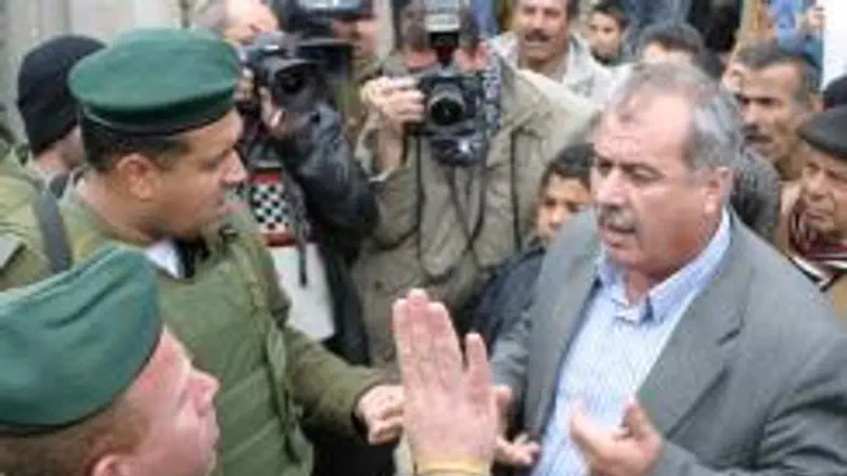 MK Mohammad Barakeh confronting soldiers