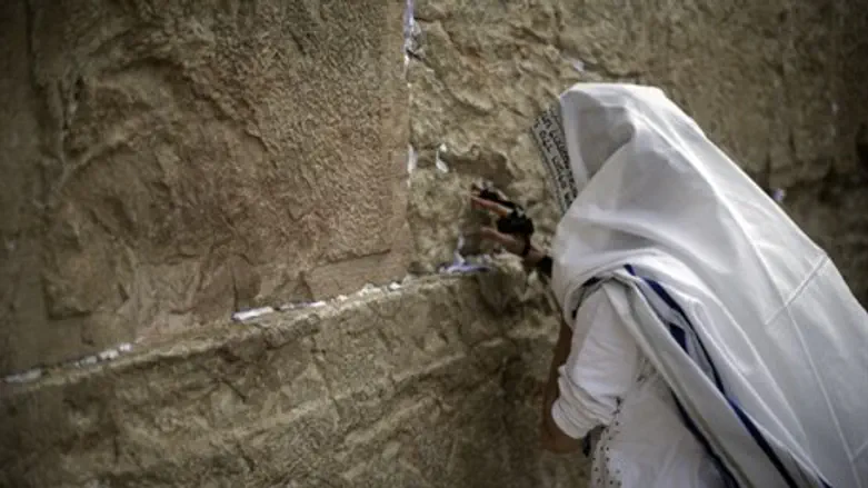 Man prays at the Kotel (Western Wall)