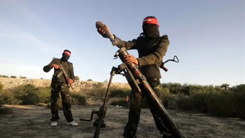 Examining mortar damage in Sha'ar HaNegev (ar