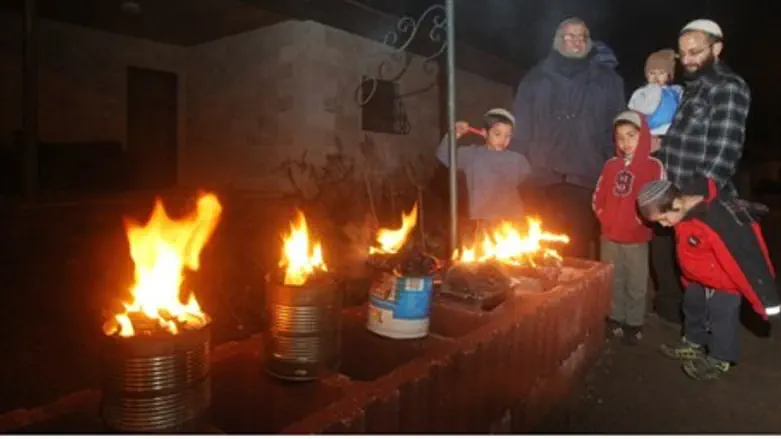Lighting 'candles' in Itamar.