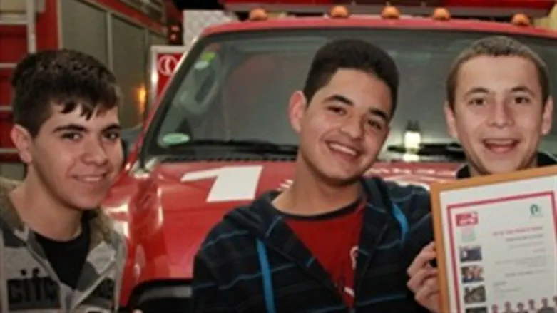 OU youth receive certificate from firemen