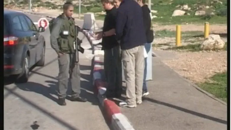 Residents warn soldiers at IDF checkpoint
