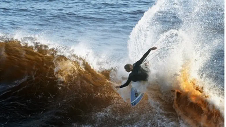 A surfer at the wave