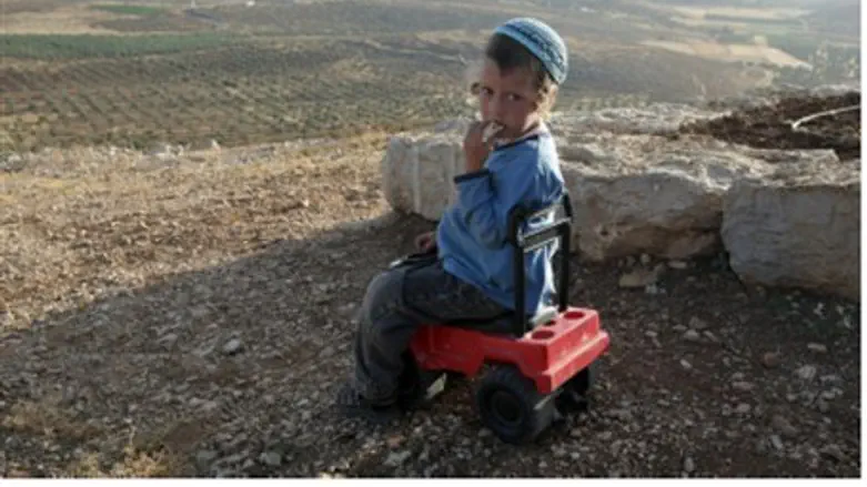 A child overlooks the community of Shvut Rach
