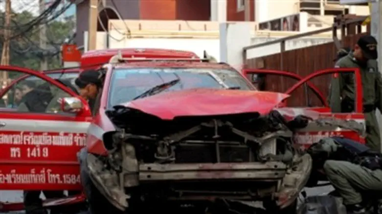 Bangkok police inspect blown-up taxi