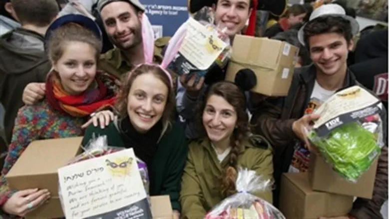 Purim New olim prepare Purim gifts for lone s