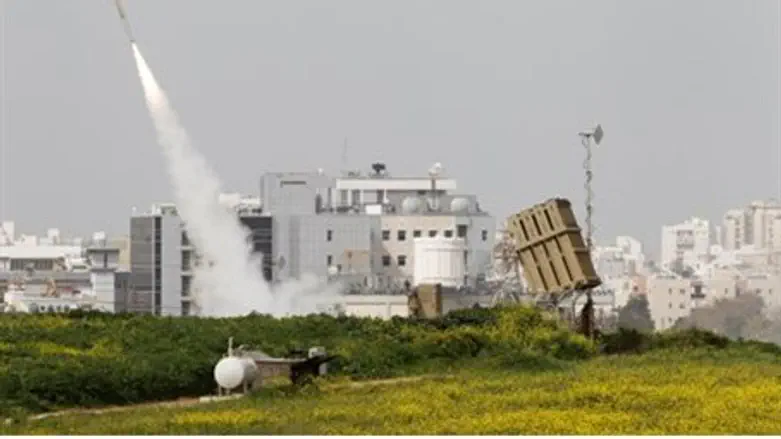 An Iron Dome launcher fires an interceptor ro