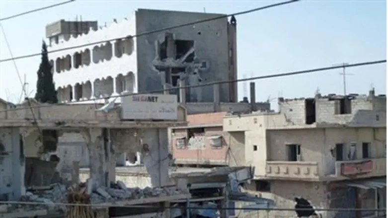 Buildings hit by government forces near Homs