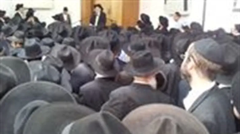 Mourners at funeral for  Nissim Toledano 
