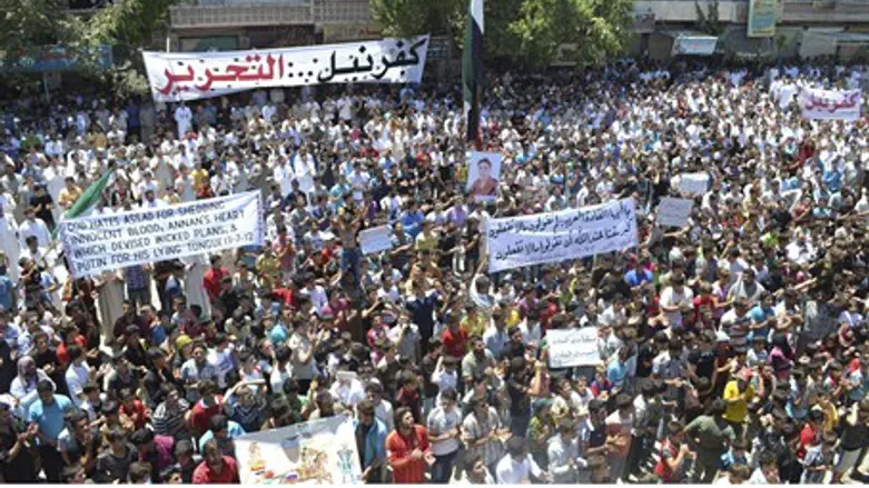 Demonstrators protest against Syria's Preside