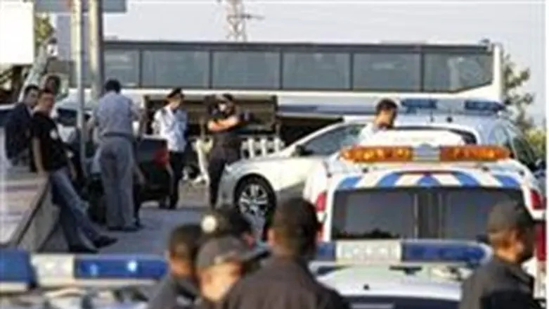 Officials confer at the scene of Wednesday's