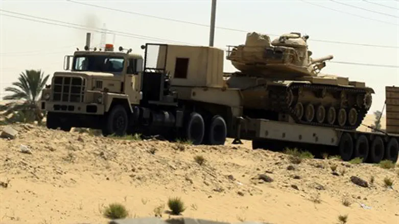 Egyptian army truck carries tanks and vehicle