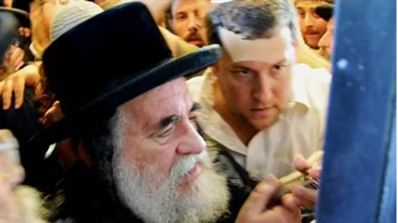 Affixing the mezuza,