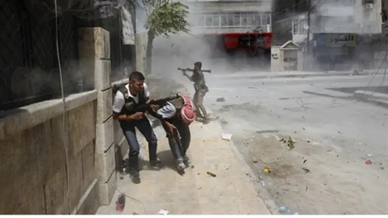 A Free Syrian Army fighter fires an RPG