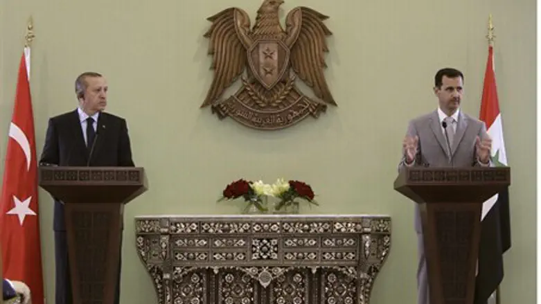 File photo of Assad and Erdogan at a news con