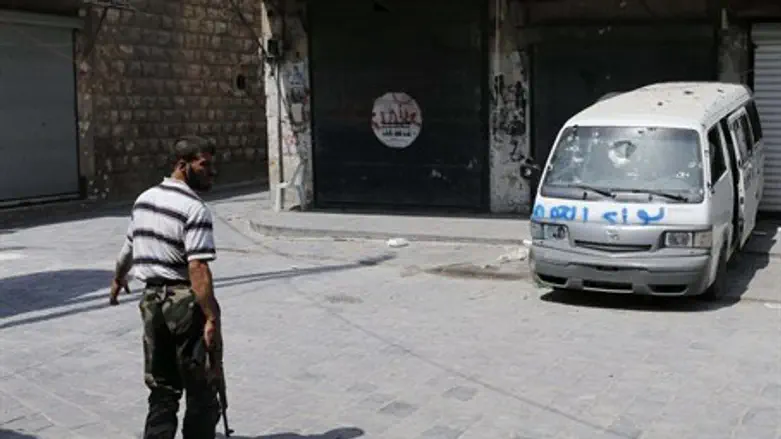 A Free Syrian Army fighter in the old city of