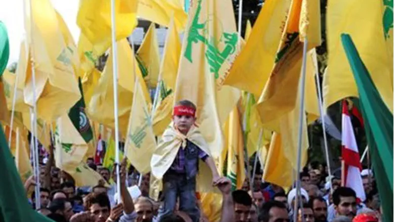 Supporters of Hizbullah leader Nasrallah wav