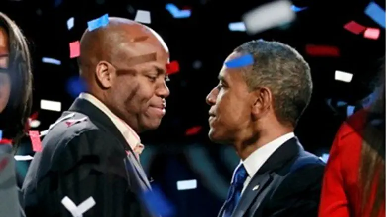 Obama (R) embraces his brother-in-law after v