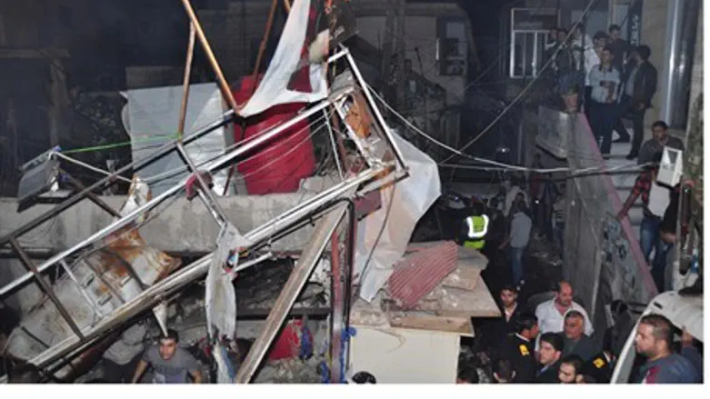 Aftermath of bombing in Hai al-Wuroud distric