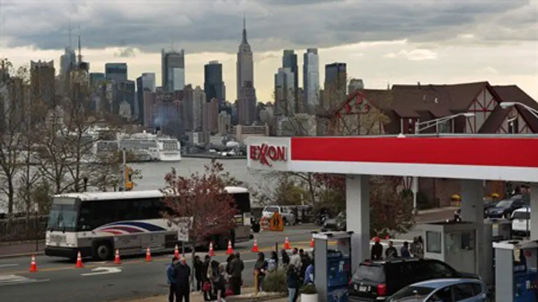 people stand in line for gas after Hurricane