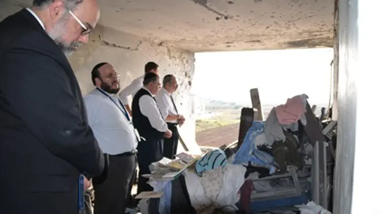 Rabbis at Demolished Appartment