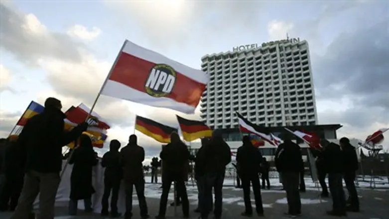 Members of the NPD attend a protest rally