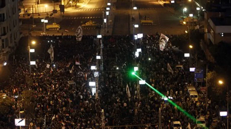 Anti-Morsi demonstrators stage a protest outs