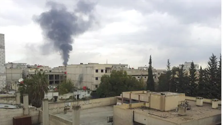 Smoke rises near Damascus
