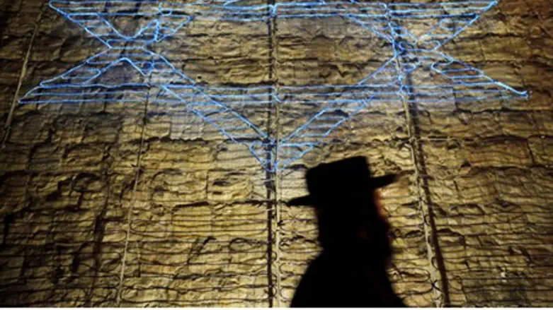 Jewish man walks by Star of David