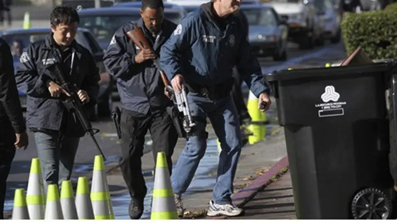 Police officers collect guns in California