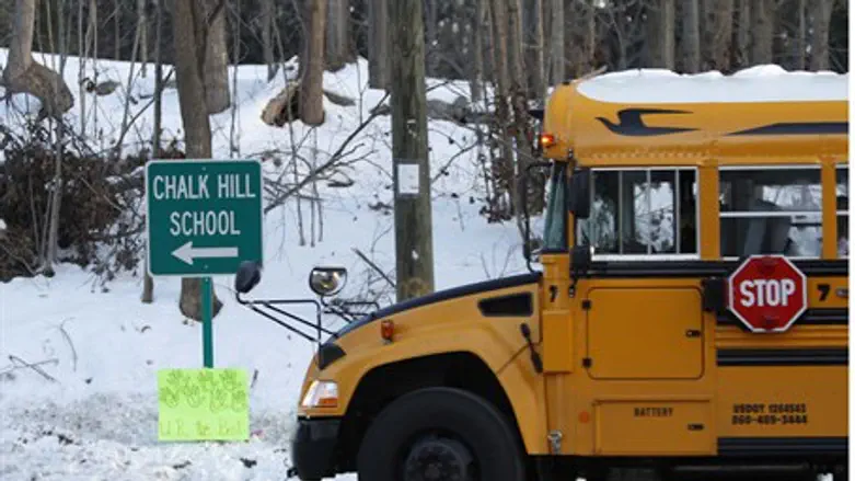 School bus takes Newtown survivors to new bui