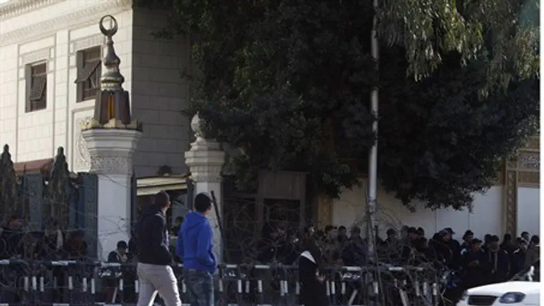 Policemen stand guard in front of the preside