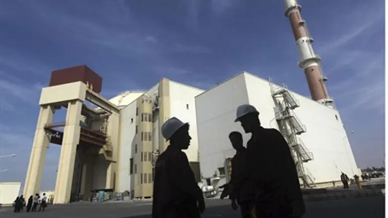 Iranian workers standing in front of the Bush