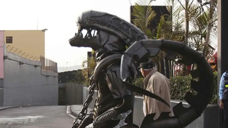 man in an alien monster costume