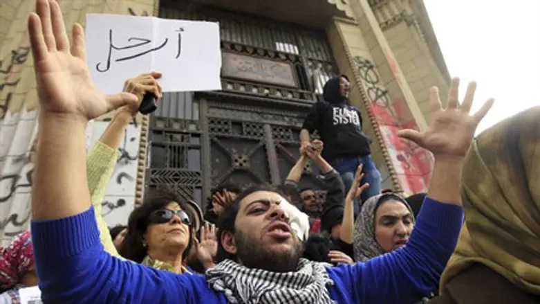 Protesters opposing Morsi during a protest ne