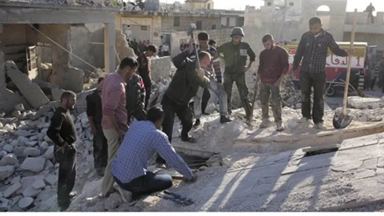 Searching for air strike survivors in Hretan,