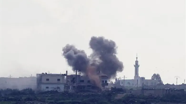 smoke rises from Syrian village