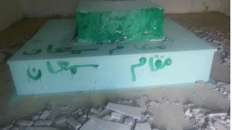 Defaced tomb